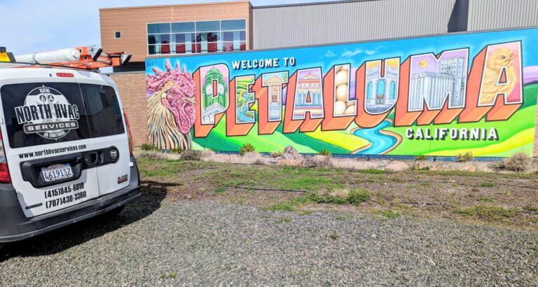 company car outside of mural