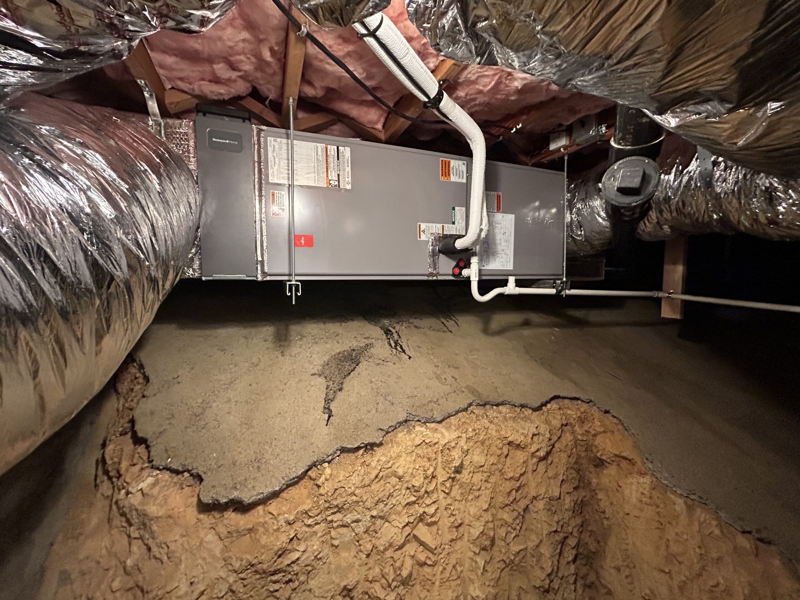HVAC air handler and ductwork installed in an attic