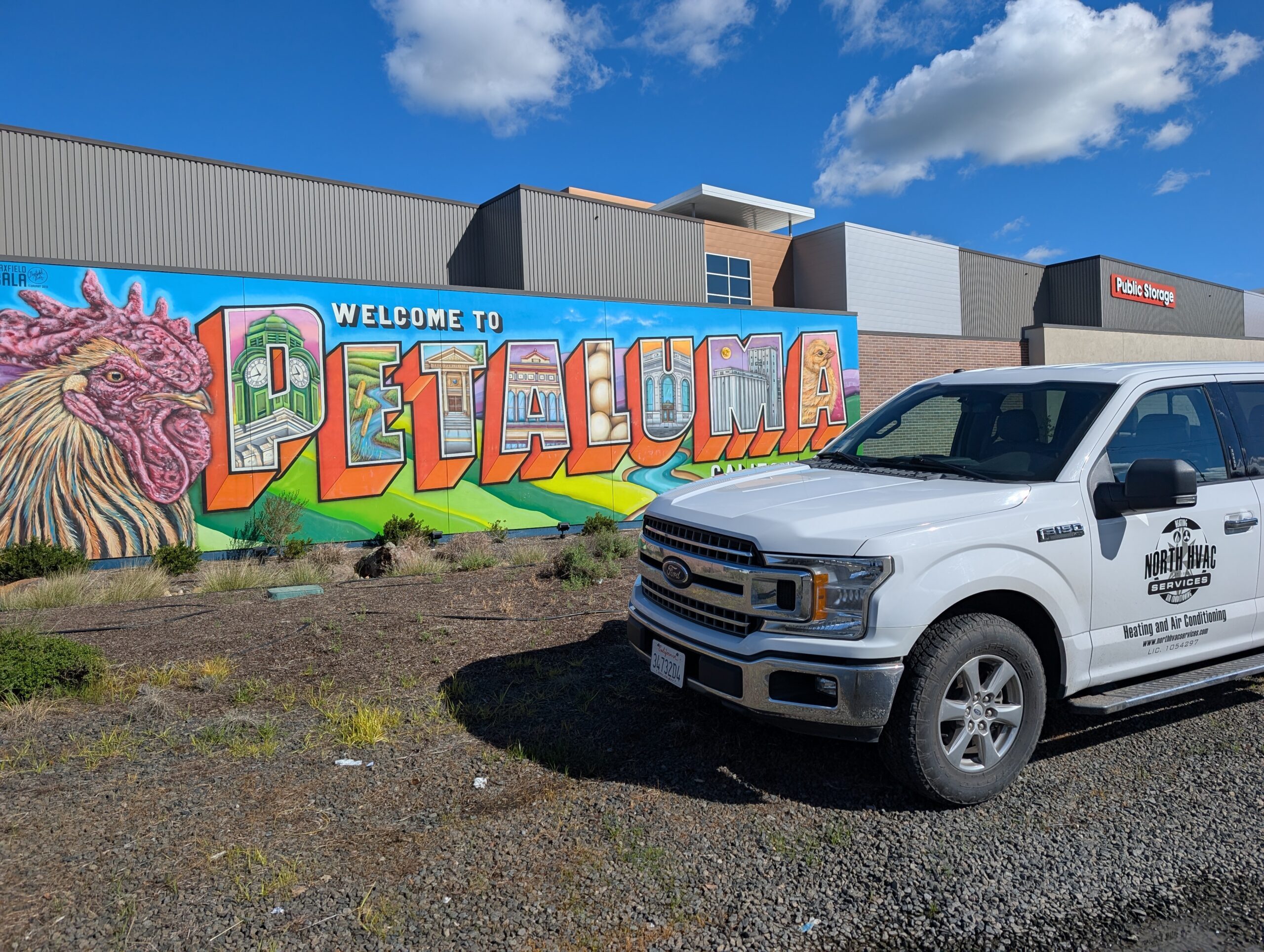 company car outside of mural