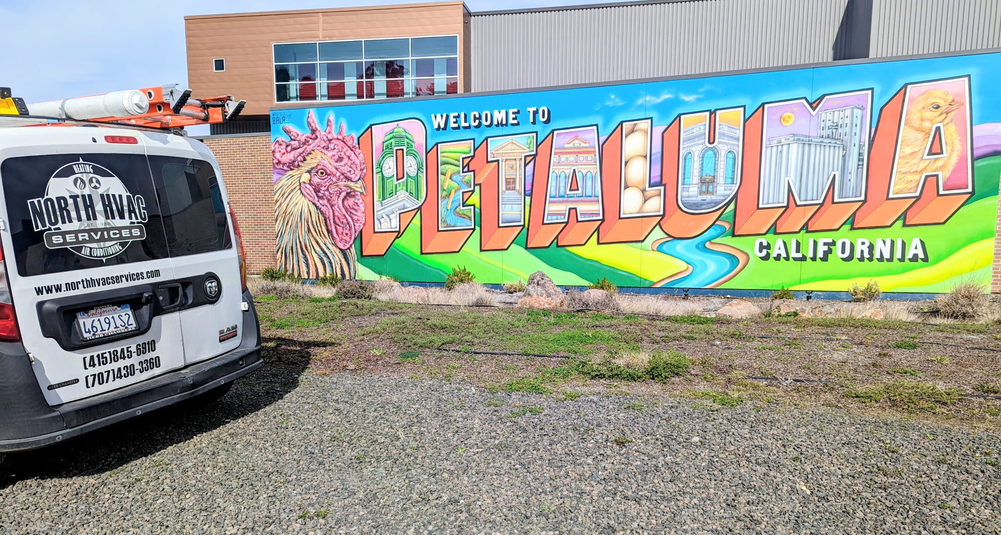 company car outside of mural